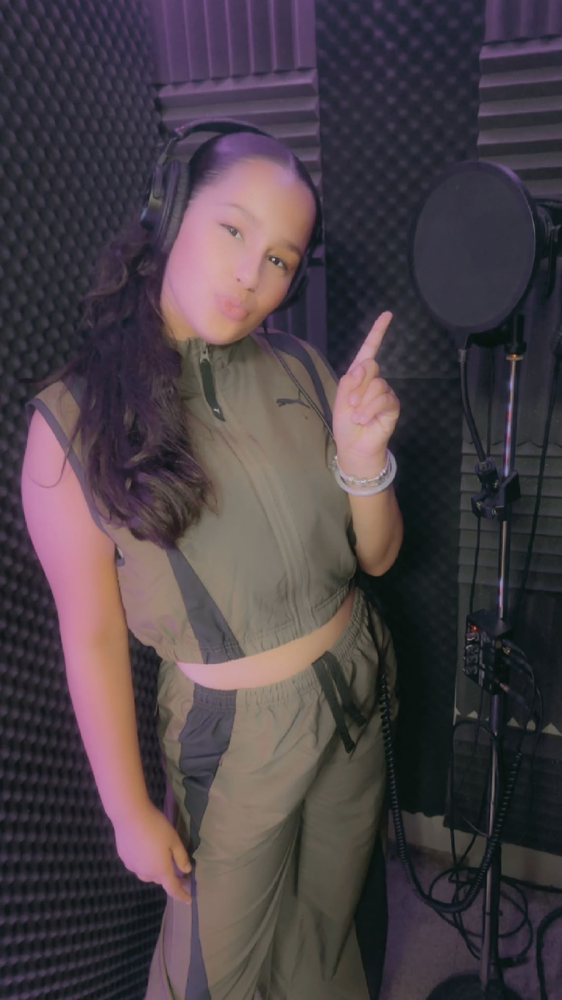 Ella-Grace in a recording booth